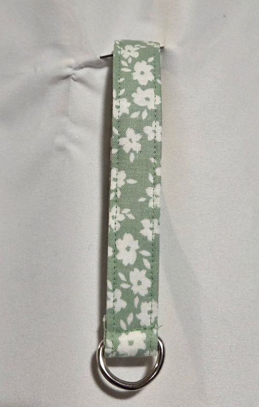 Light green and white floral wristlet